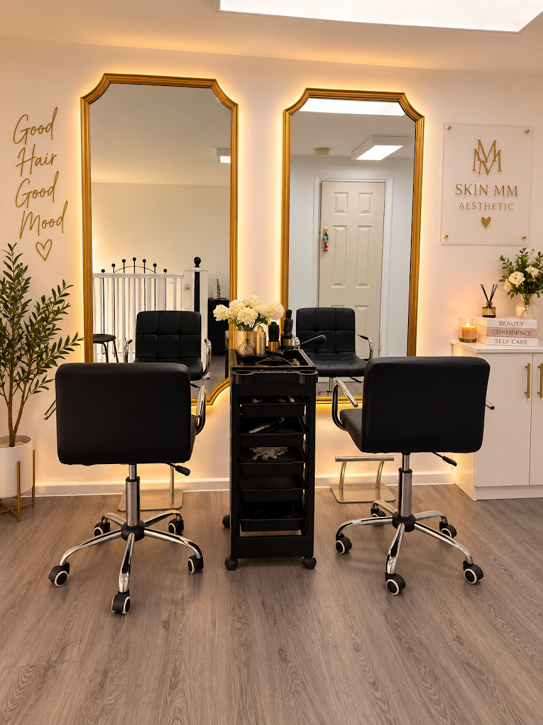 Skin MM Beauty Clinic salon interior with gold mirrors and treatment chairs